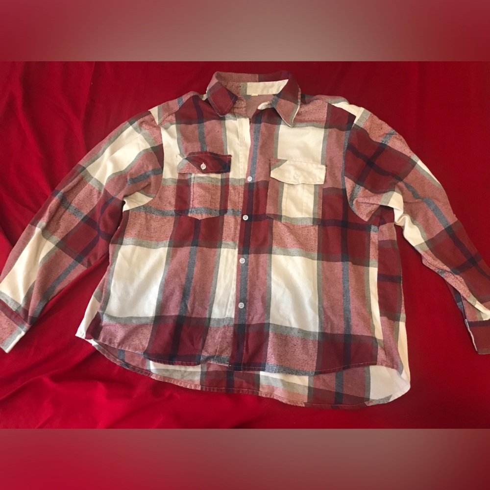 Red checkered flannel. Size M. Worn quite a bit. Missing on button near the top.